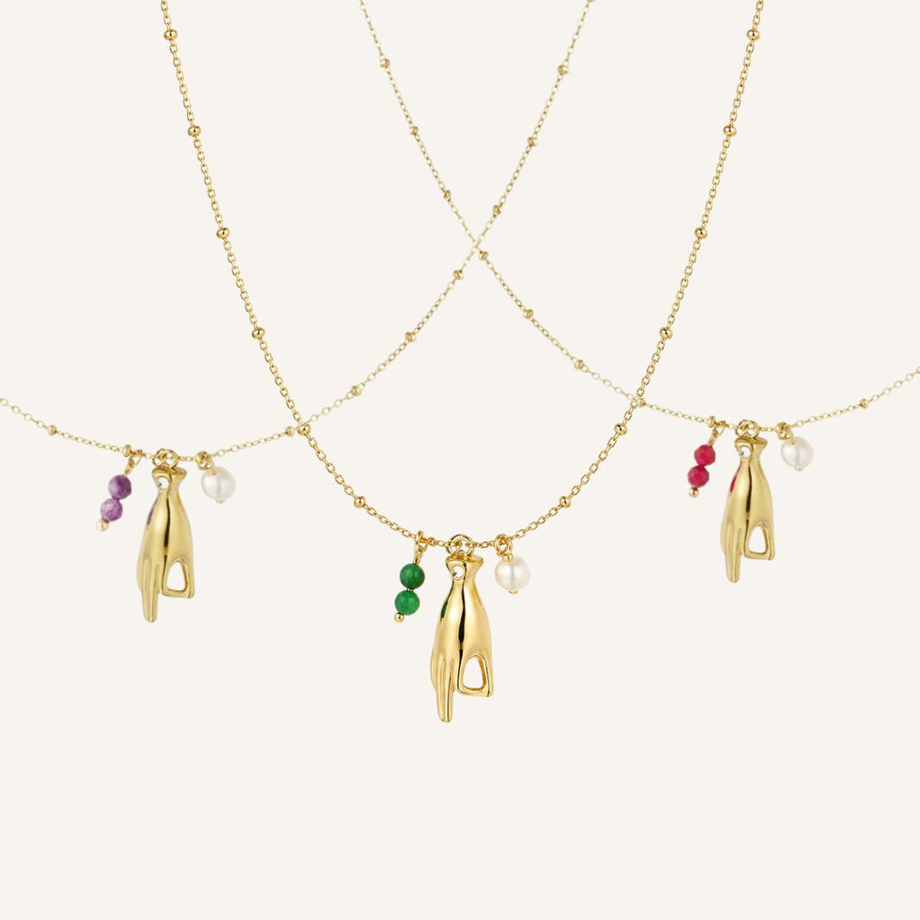Mantra · Collar con mano protectora y perla