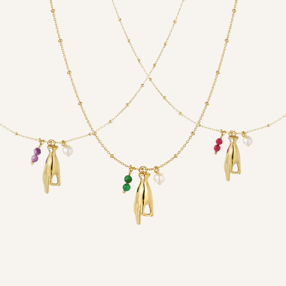 Mantra · Collar con mano protectora y perla